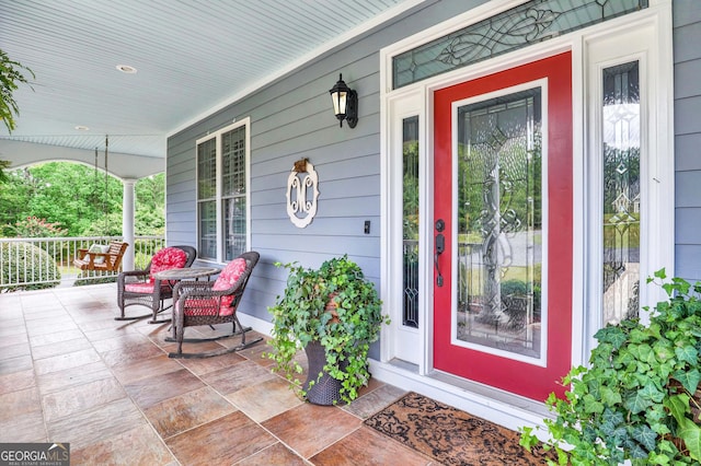 entrance to property featuring covered porch