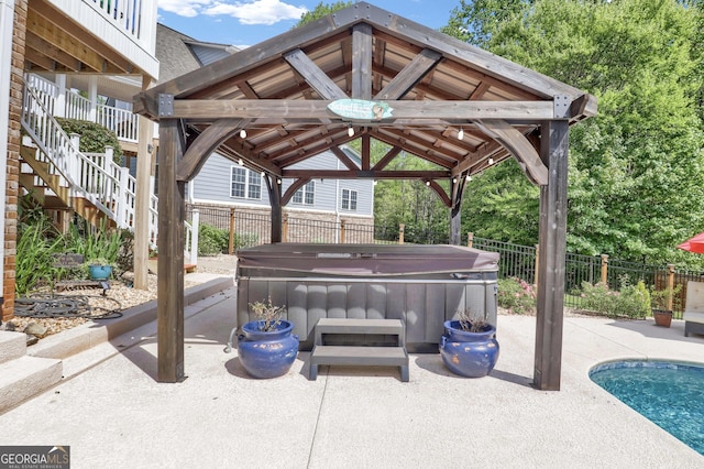 view of patio with a hot tub