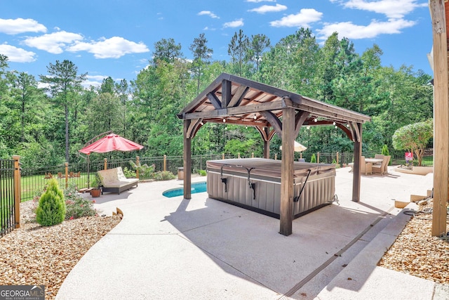 view of patio with a gazebo and a hot tub