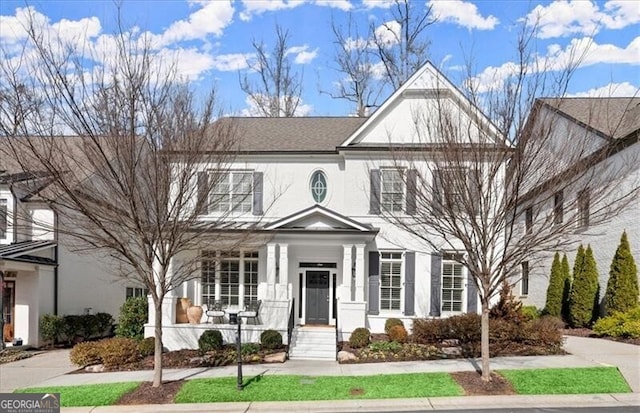 view of front of property featuring a porch and stucco siding