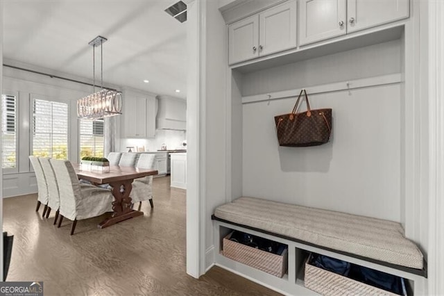 mudroom featuring a chandelier, dark wood-type flooring, visible vents, and recessed lighting