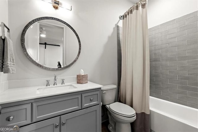 bathroom featuring shower / bath combo, vanity, and toilet