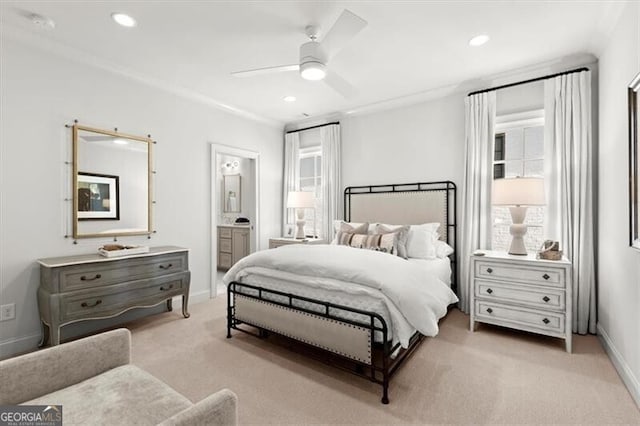 bedroom with light carpet, ensuite bath, baseboards, and recessed lighting