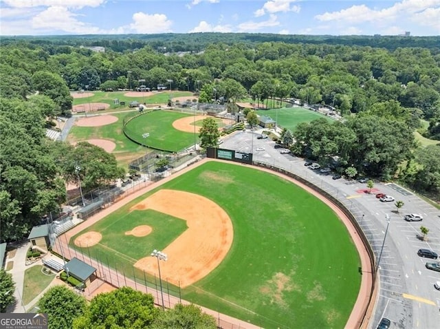 birds eye view of property with a view of trees