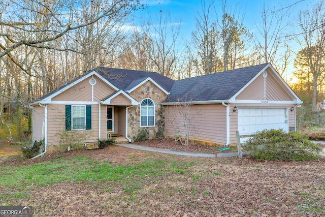 single story home with a garage, stone siding, and a shingled roof