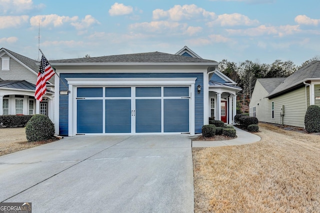 view of front facade featuring a garage and concrete driveway