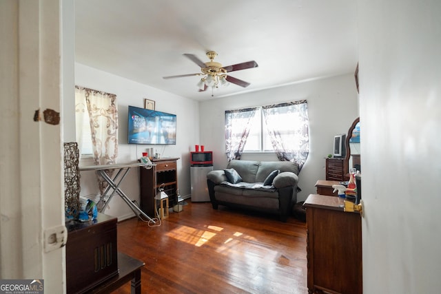 interior space featuring dark wood-style flooring and ceiling fan