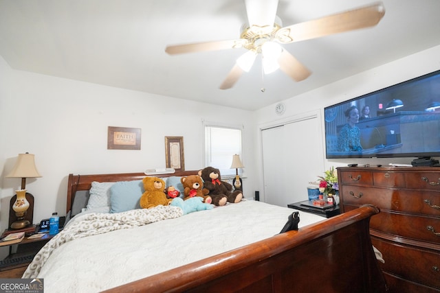 bedroom with ceiling fan and a closet