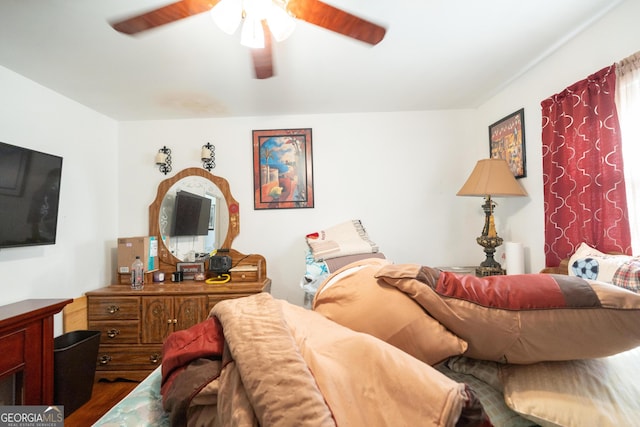 bedroom with a ceiling fan and wood finished floors