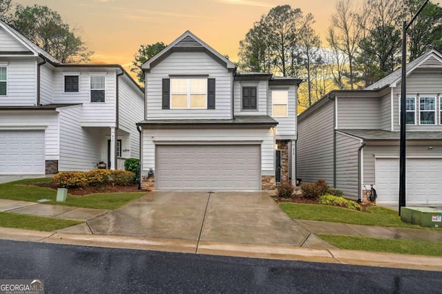 view of front of house featuring an attached garage and concrete driveway