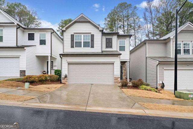 view of front of house with an attached garage and driveway