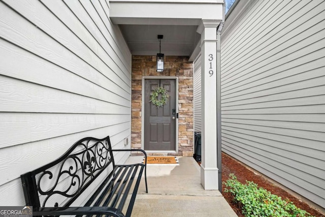 view of exterior entry with stone siding