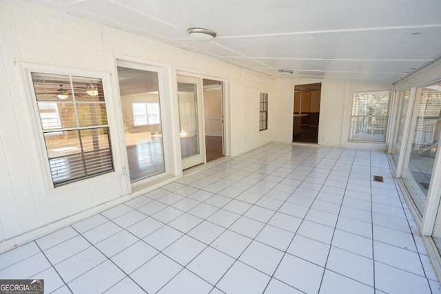 unfurnished sunroom with plenty of natural light