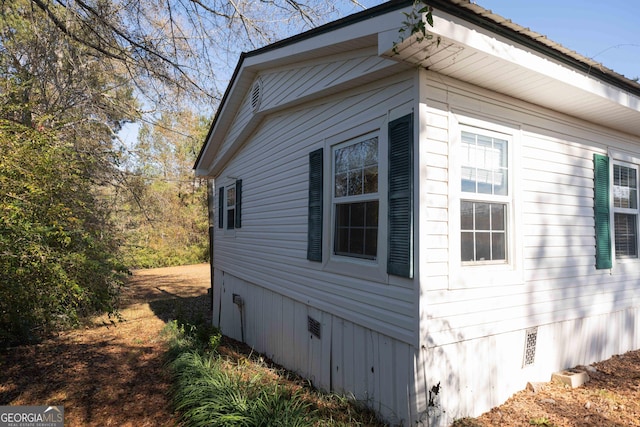 view of side of property featuring crawl space