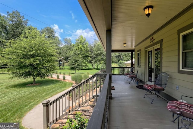 153 Falls Creek Dr, Hiawassee, GA 30546 - porch featuring a lawn, french doors, and view of wooded area