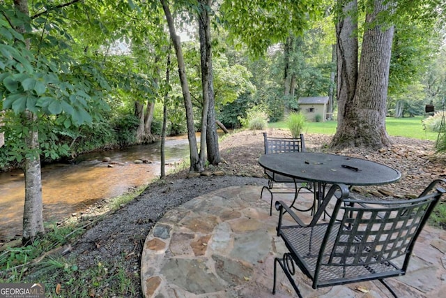 153 Falls Creek Dr, Hiawassee, GA 30546 - view of patio featuring outdoor dining area and an outbuilding