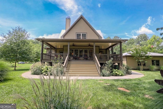 153 Falls Creek Dr, Hiawassee, GA 30546 - back of property featuring stairs, a ceiling fan, a yard, and a chimney