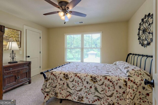 153 Falls Creek Dr, Hiawassee, GA 30546 - bedroom with light colored carpet and ceiling fan