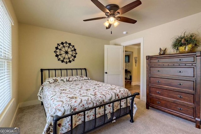 153 Falls Creek Dr, Hiawassee, GA 30546 - bedroom featuring light colored carpet, multiple windows, and ceiling fan
