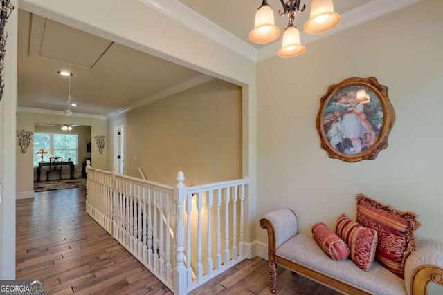 153 Falls Creek Dr, Hiawassee, GA 30546 - corridor featuring attic access, crown molding, hardwood / wood-style floors, and a chandelier