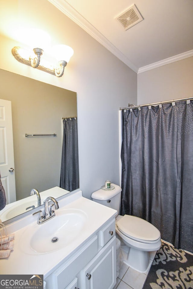 bathroom with visible vents, toilet, ornamental molding, vanity, and tile patterned flooring