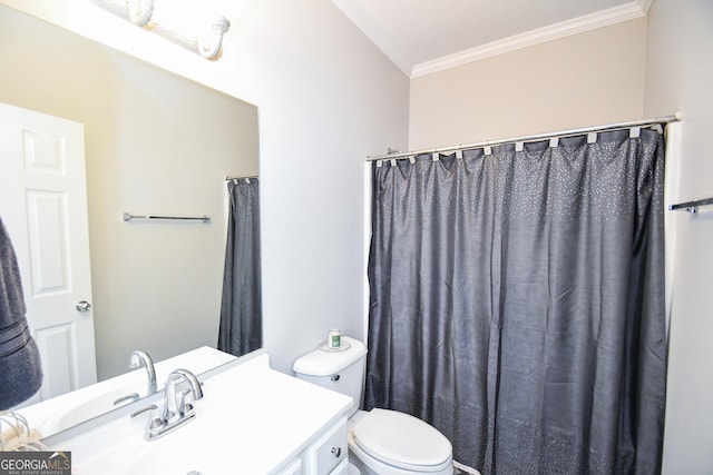 full bathroom featuring ornamental molding, vanity, and toilet