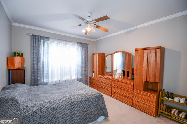 bedroom with ceiling fan, carpet floors, and ornamental molding