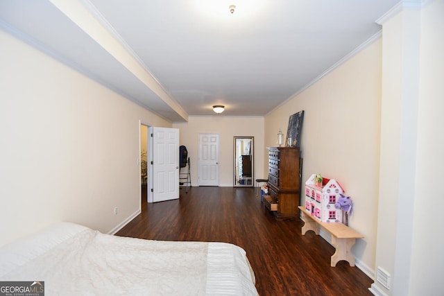 bedroom with baseboards, ornamental molding, and dark wood-type flooring