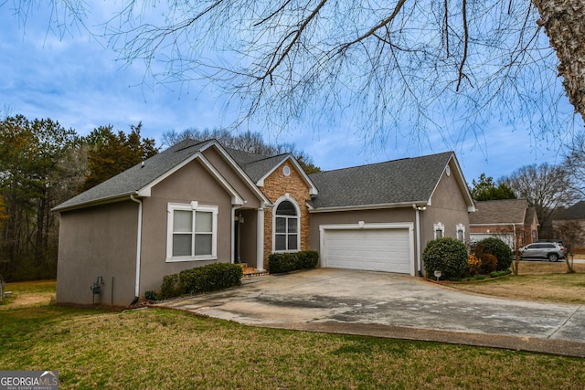 view of front of house featuring a garage, a front yard, and stucco siding