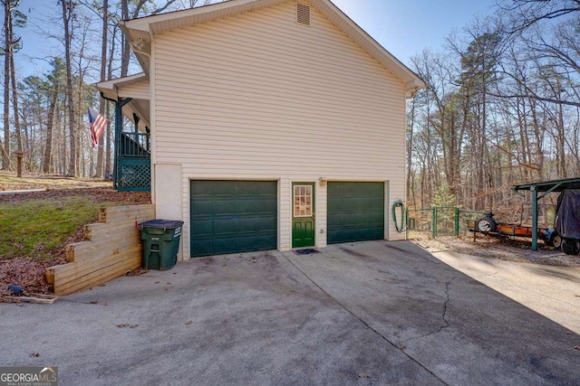 view of side of home with an attached garage