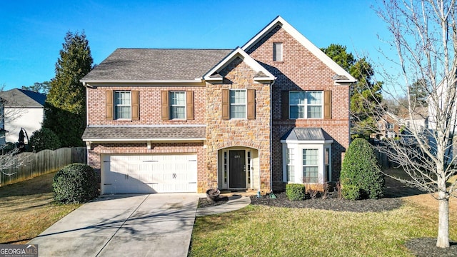 view of front of home featuring driveway, a front lawn, fence, and brick siding