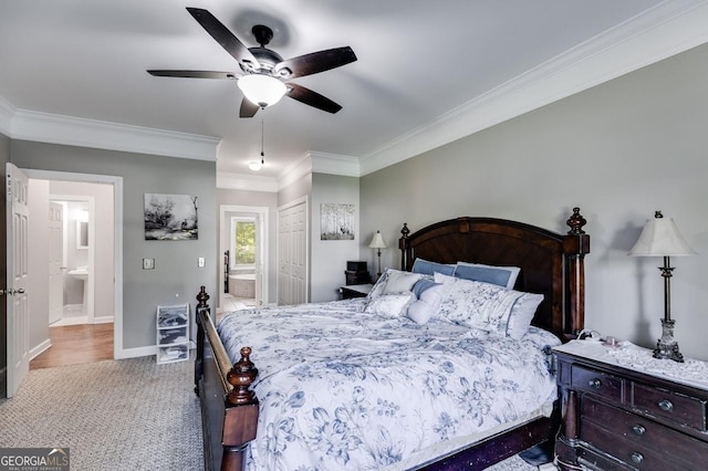 carpeted bedroom with ornamental molding, baseboards, a closet, and a ceiling fan