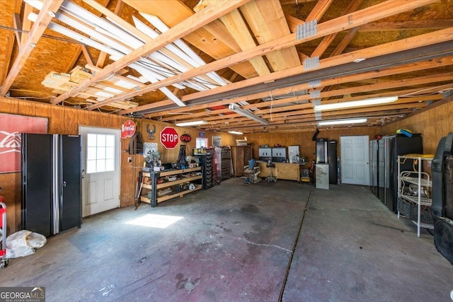 garage with freestanding refrigerator