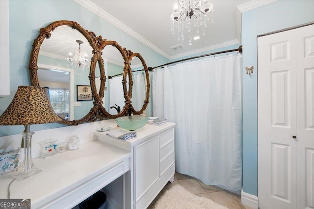 bathroom featuring vanity, an inviting chandelier, ornamental molding, visible vents, and tile patterned floors