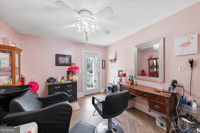 office with baseboards, ceiling fan, and light tile patterned floors