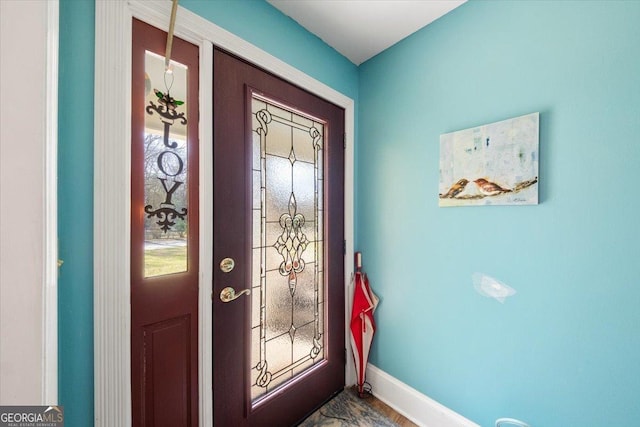 foyer entrance with baseboards