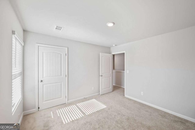 6713 Moondancer Ct, Flowery Branch, GA 30542 - unfurnished bedroom with carpet flooring and a closet