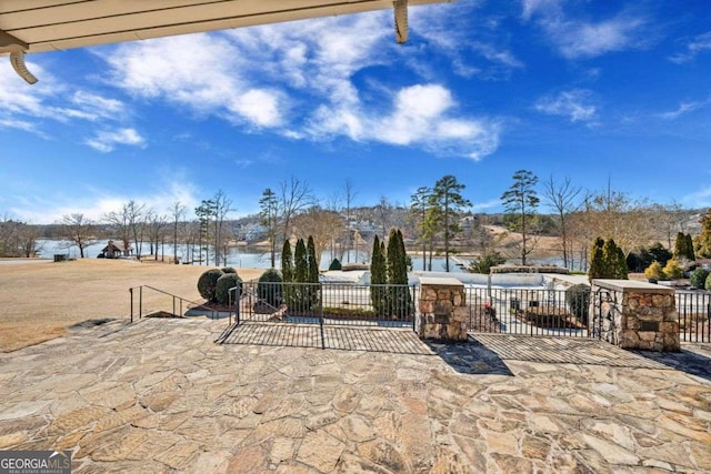 6713 Moondancer Ct, Flowery Branch, GA 30542 - view of patio featuring a water view