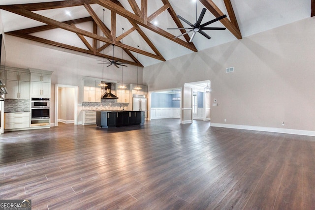 unfurnished living room featuring baseboards, a ceiling fan, visible vents, and dark wood-type flooring