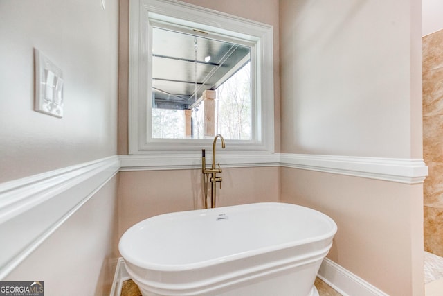 bathroom with a freestanding bath