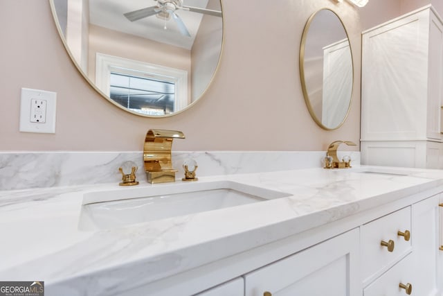 full bath featuring a sink and double vanity