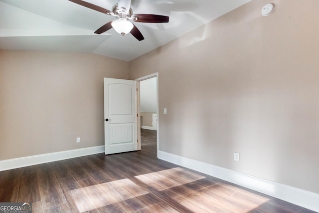 unfurnished bedroom featuring dark wood finished floors, baseboards, a ceiling fan, and lofted ceiling