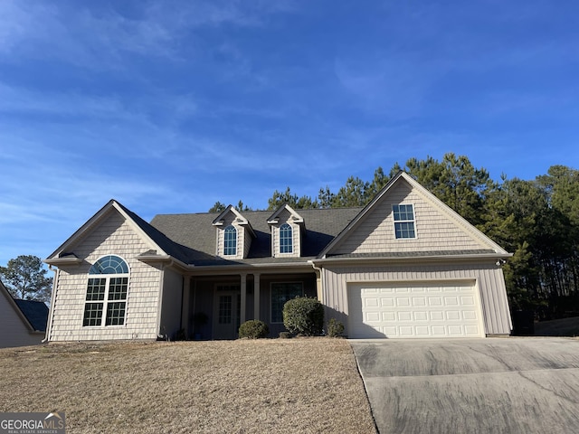 view of front of house featuring a garage, board and batten siding, and concrete driveway