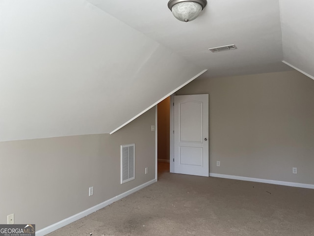 bonus room featuring visible vents, baseboards, and vaulted ceiling