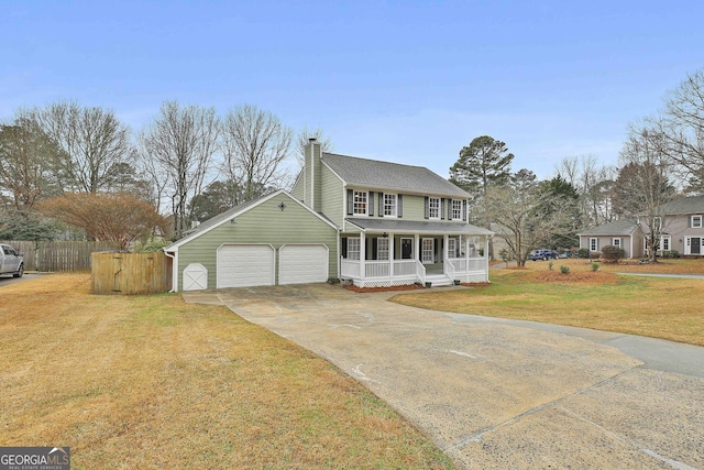 view of front of property featuring fence, concrete driveway, a front lawn, a porch, and an attached garage