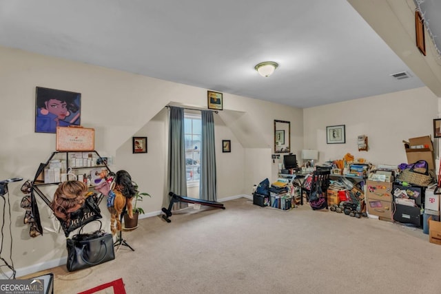 interior space with baseboards, visible vents, and carpet flooring