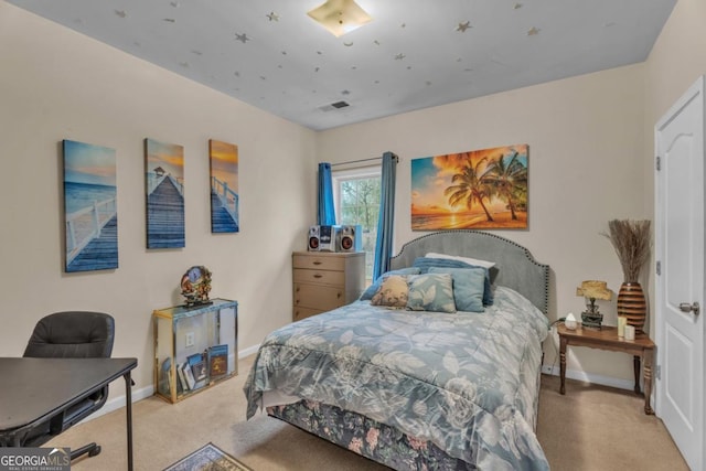 bedroom featuring visible vents, baseboards, and light colored carpet