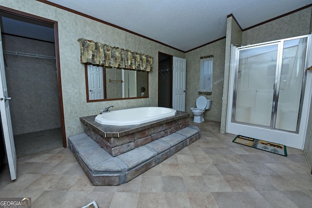 bathroom featuring toilet, crown molding, wallpapered walls, and a shower stall