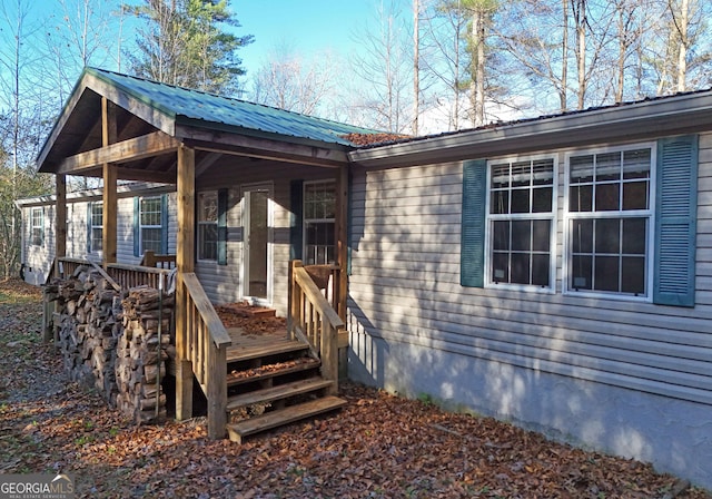 exterior space featuring metal roof