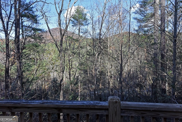 view of landscape with a forest view and a mountain view